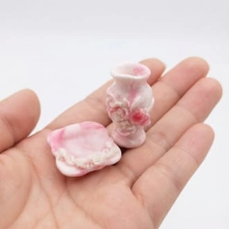 Pink floral vase and plate dollhouse miniature set. This product adds elegant detail to any tiny scene.
