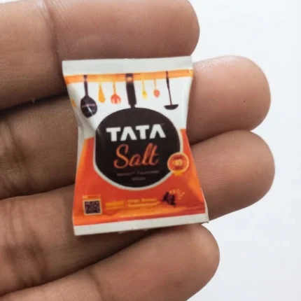 Highly detailed miniature replica of a Tata Salt packet, a collectible product for dollhouses or displays.