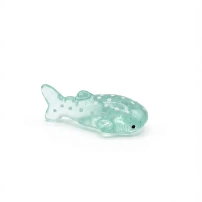 Teal miniature whale shark figurine product, beautifully crafted for desk or shelf display, capturing ocean life.