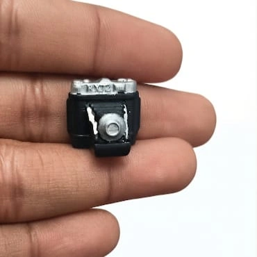 Detailed vintage camera miniature figurine product, ideal for collectors, miniature scenes, or unique desk decor.