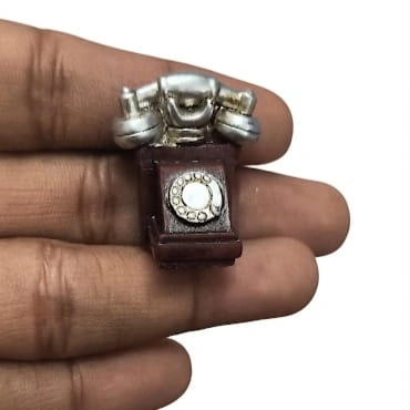 Detailed vintage rotary desk telephone miniature figurine product, ideal for dollhouse scenes or diorama displays.