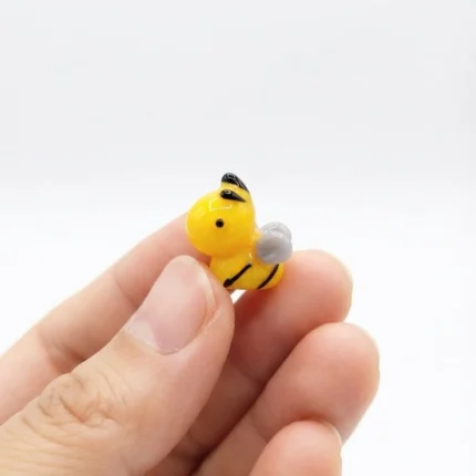 Delicate yellow bee glass miniature figurine, a charming product for collectors or home decor.