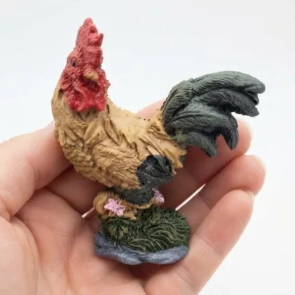 Detailed tan and dark miniature rooster product on a vibrant green grass base, perfect for display.