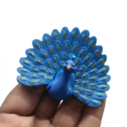 Detailed blue peacock miniature figurine product, ideal for collectors and enhancing any desk or shelf.