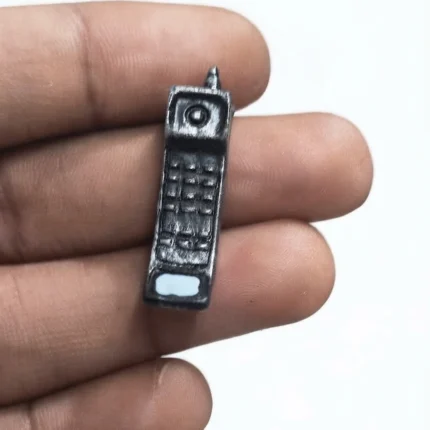 Detailed miniature brick cell phone figurine, a charming retro product for dollhouse scenes or collector displays.