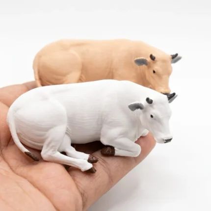 Charming miniature cow figurine product, randomly selected for collectors, ideal for dioramas or dollhouses.