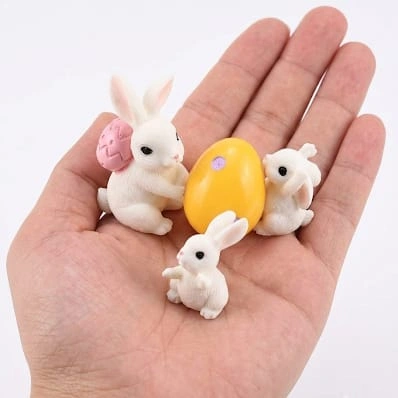 Miniature Easter bunny figurine set of 4 product, ideal for dollhouse scenes or festive holiday displays.