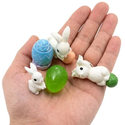 Miniature Easter figurine set of 5, perfect for dollhouse displays. This product adds festive holiday decor.