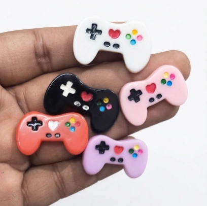 Detailed miniature gaming controller figurine product, random design for collectors and gamers.