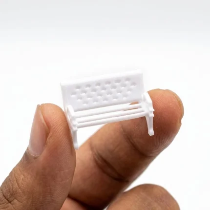 Detailed miniature garden bench figurine product, ideal for fairy gardens or dollhouse scenes.