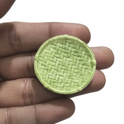 Beautifully crafted miniature green woven plate, an essential product for dollhouse kitchens or miniature displays.