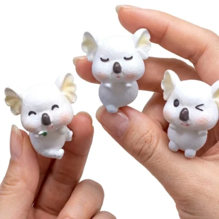 A charming miniature koala figurine product, randomly selected, perfect for adding a cute touch to any display.