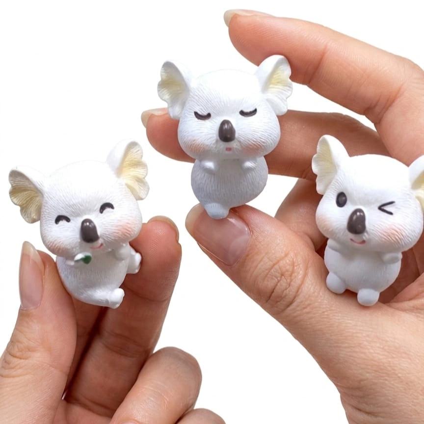 Miniature-Koala-Figurine-Set-of-3-1 A charming miniature koala figurine product, randomly selected, perfect for adding a cute touch to any display.