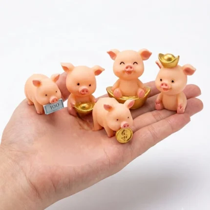 Miniature lucky pig figurine, random design. A charming collectible product or dollhouse accessory.