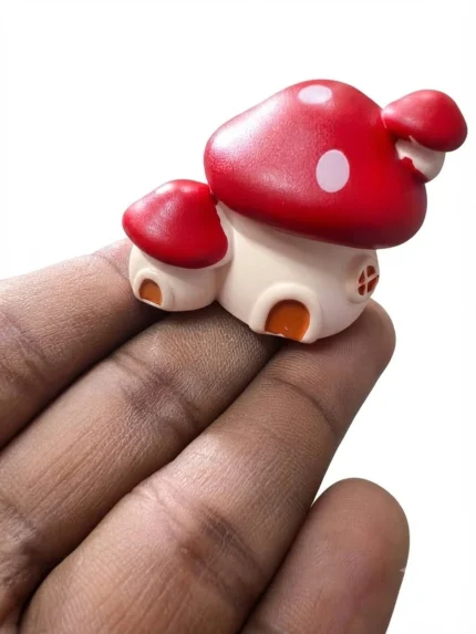 Charming miniature mushroom house figurine product, ideal for fairy gardens and dollhouse displays.