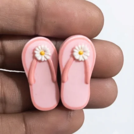 Adorable miniature pink flip flop sandals product for dollhouse displays, fairy gardens, or tiny beach scenes.