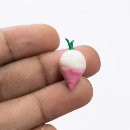 Beautifully detailed miniature pink and white turnip figurine product, perfect for miniature gardens or displays.