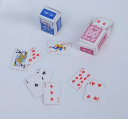 A finely detailed miniature playing cards figurine product, perfect for dollhouse scenes, dioramas, or collectors.