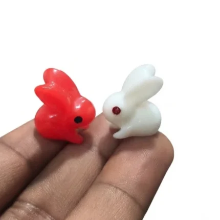 A charming miniature rabbit figurine set of 2 product, perfect for dollhouse scenes or decorative displays.