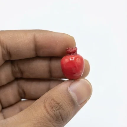 Beautifully crafted miniature red pomegranate figurine product, perfect for dollhouse or miniature scene.