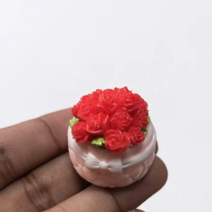 Delightful miniature red rose flower cup product, perfect for dollhouse or miniature display.