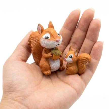 A charming miniature squirrel figurine set of 2 product, great for adding nature to any display or collection.