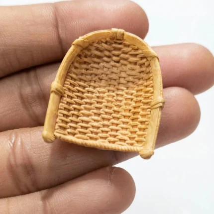 Handcrafted miniature wicker chair product, ideal for dollhouse or miniature display.