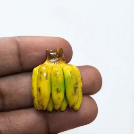Detailed yellow miniature banana bunch figurine product for dollhouse kitchens or dioramas.