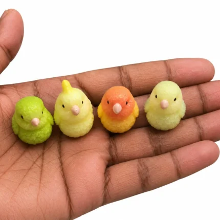 A charming miniature baby chick figurine product, ideal for adding cuteness to any display or collection.