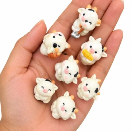 A delightful miniature cartoon cow figurine product, perfect for adding a whimsical touch to any display.