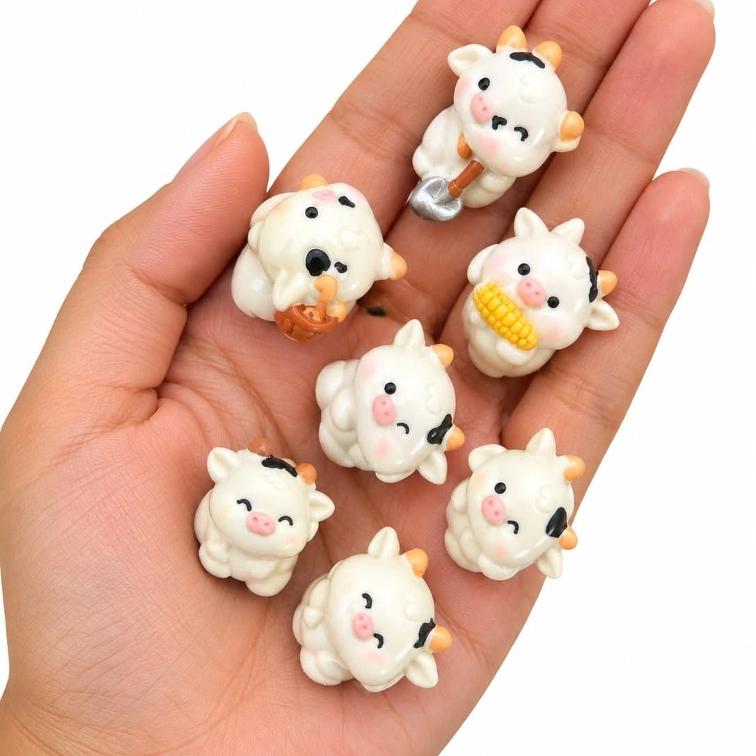 Miniature-Cartoon-Cow-Figurine-Set-of-7 A delightful miniature cartoon cow figurine product, perfect for adding a whimsical touch to any display.