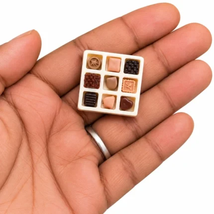This exquisite miniature chocolate box figurine product is ideal for dollhouse decor, dioramas, and collectors.