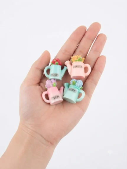 Charming miniature flower watering can, randomly selected, ideal for dollhouse or miniature garden product display.