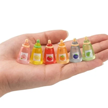 Detailed miniature fruit sauce bottle, chosen at random, perfect for any dollhouse or miniature product display.