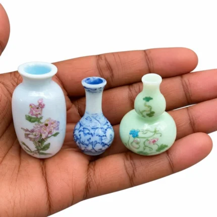 A beautifully crafted miniature gourd porcelain vase product, featuring a unique random design for dollhouse decor.