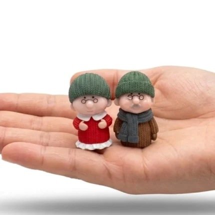 A charming set of two miniature grandma and grandpa figurines, perfect for any miniature display product.