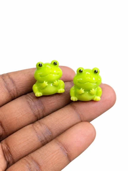Miniature green frog figurine product, random design, perfect for adding nature to any display.