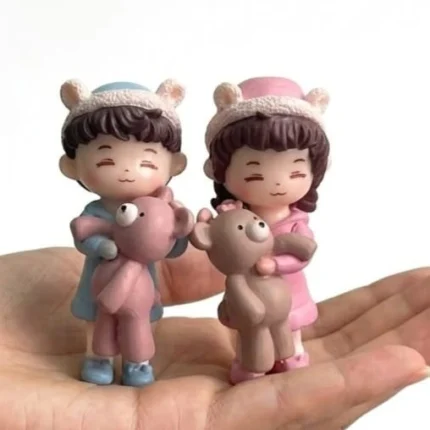 Charming miniature kids figurine product set of 2, with two children, one holding a teddy bear, for dollhouse.