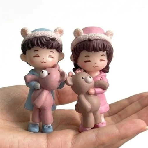 Miniature-Kids-with-Teddy-Bear-Figurine-Set-of-2-1 Charming miniature kids figurine product set of 2, with two children, one holding a teddy bear, for dollhouse.