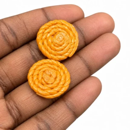 A detailed miniature product featuring two realistic orange murukku snacks, perfect for collectors and display.