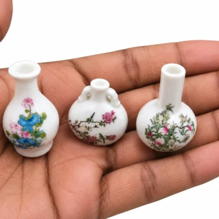 Delicate miniature porcelain bud vase product, unique random design, ideal for dollhouse or diorama display.