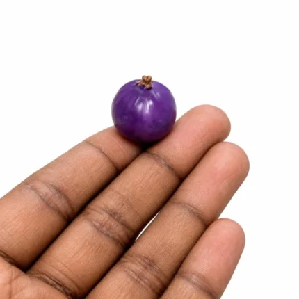A detailed miniature purple round fruit figurine product, perfect for adding a vibrant, tiny accent to any display.