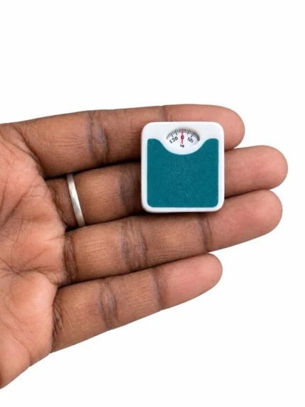 Detailed miniature teal weighing scale figurine product, ideal for dollhouse kitchen scenes or miniature displays.