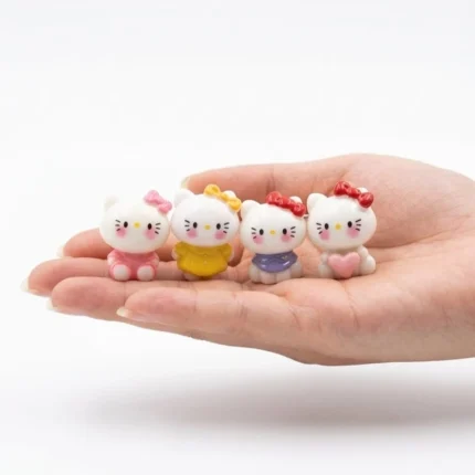 Charming miniature white kitty cat figurine, a collectible product for dollhouse scenes or miniature displays.